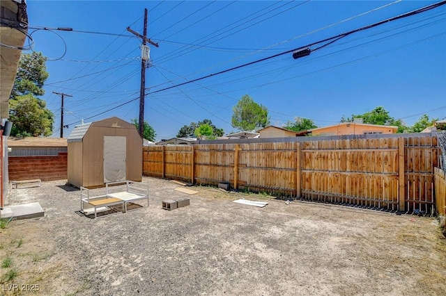 1708 Cedar Ave, Las Vegas, NV 89101 - fenced backyard featuring a storage unit