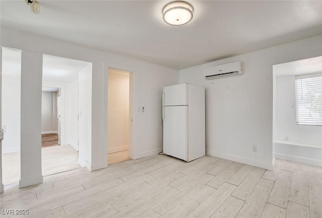 1708 Cedar Ave, Las Vegas, NV 89101 - unfurnished room with a wall mounted air conditioner and light wood-type flooring