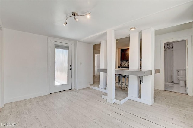 1708 Cedar Ave, Las Vegas, NV 89101 - unfurnished living room featuring light wood-type flooring and baseboards