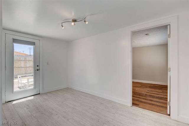 1708 Cedar Ave, Las Vegas, NV 89101 - spare room featuring wood finished floors and baseboards