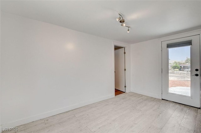 1708 Cedar Ave, Las Vegas, NV 89101 - empty room featuring light wood-style flooring and baseboards