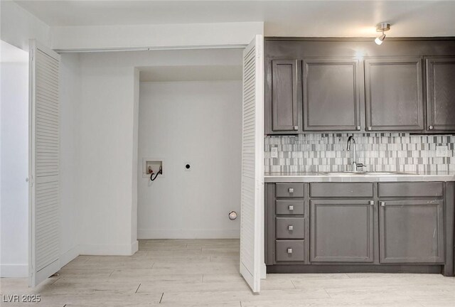 1708 Cedar Ave, Las Vegas, NV 89101 - washroom with electric dryer hookup, hookup for a washing machine, and light wood-style flooring