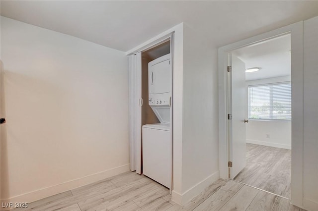 1708 Cedar Ave, Las Vegas, NV 89101 - laundry area featuring stacked washer / drying machine and light wood finished floors