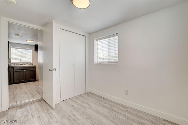 1708 Cedar Ave, Las Vegas, NV 89101 - unfurnished bedroom with light wood-style flooring and a closet
