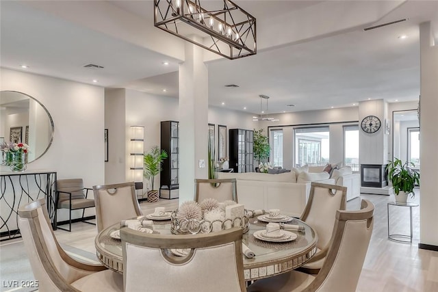 5438 Sierra Brook Ct, Las Vegas, NV 89149 - dining space with light wood-style floors and recessed lighting