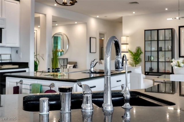 5438 Sierra Brook Ct, Las Vegas, NV 89149 - kitchen featuring dark countertops and recessed lighting