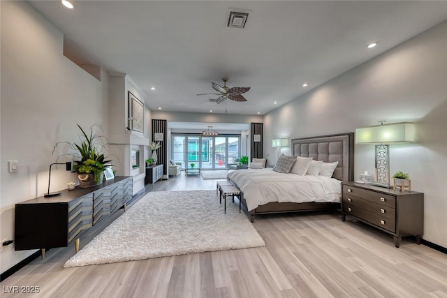 5438 Sierra Brook Ct, Las Vegas, NV 89149 - bedroom featuring light wood-style flooring, access to exterior, recessed lighting, and ceiling fan