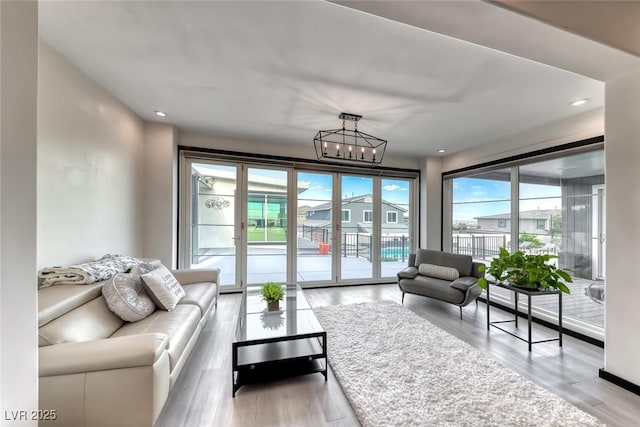 5438 Sierra Brook Ct, Las Vegas, NV 89149 - living area featuring a chandelier, wood finished floors, and recessed lighting