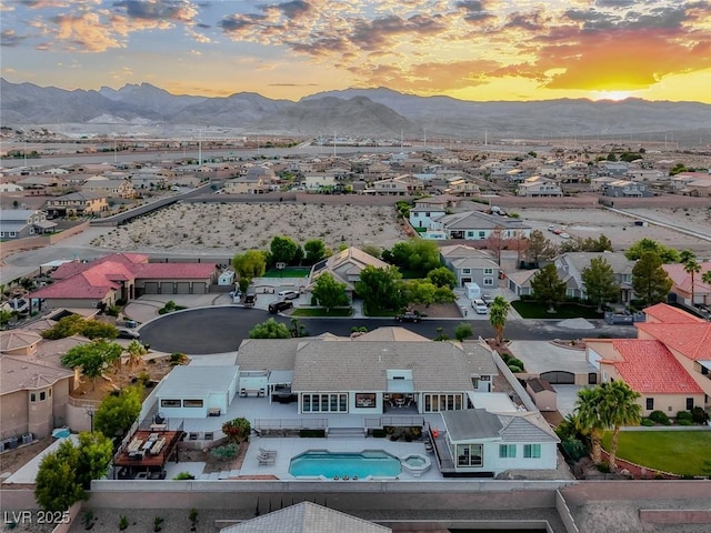 5438 Sierra Brook Ct, Las Vegas, NV 89149 - aerial view at dusk of a mountain view, a residential view, and view of pool area