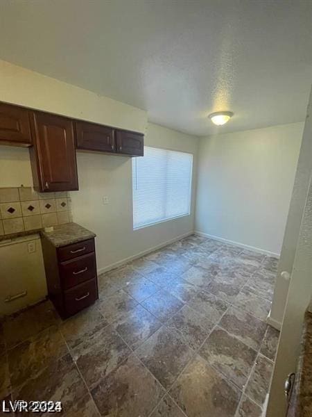 1745 Starridge Way, Las Vegas, NV 89142 - kitchen featuring baseboards and a textured ceiling