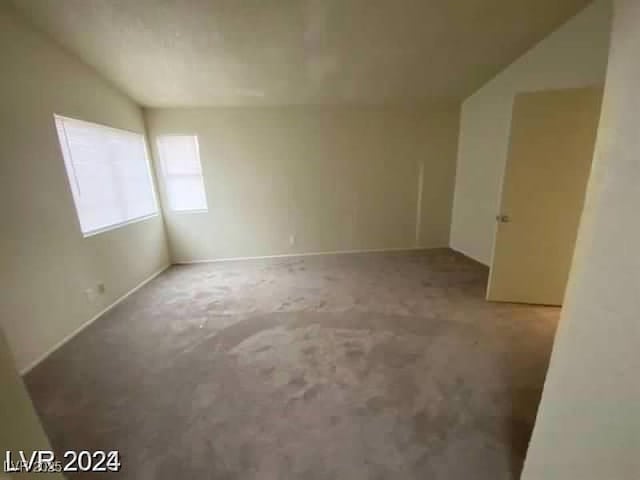 1745 Starridge Way, Las Vegas, NV 89142 - carpeted empty room featuring lofted ceiling