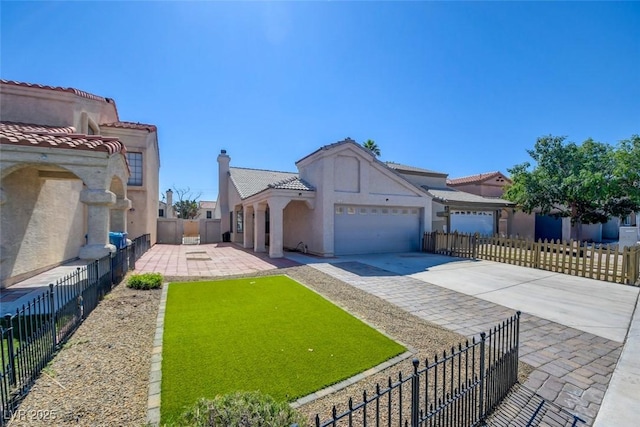 116 Lotus Blossom Ct, Las Vegas, NV 89145 - mediterranean / spanish house with an attached garage, driveway, stucco siding, and a tiled roof