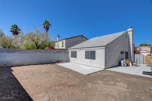 116 Lotus Blossom Ct, Las Vegas, NV 89145 - rear view of property featuring a patio area, a fenced backyard, stucco siding, and a tile roof