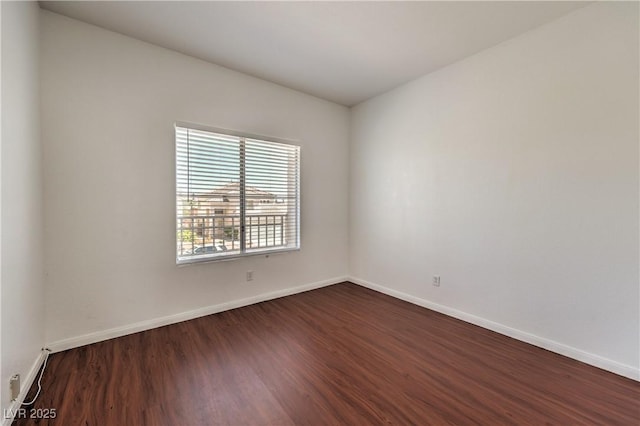 7977 Blue Brook Dr, Las Vegas, NV 89147 - unfurnished room with dark wood-style flooring and baseboards