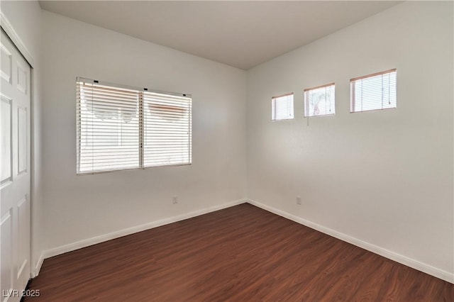 7977 Blue Brook Dr, Las Vegas, NV 89147 - unfurnished room with dark wood-style flooring and baseboards