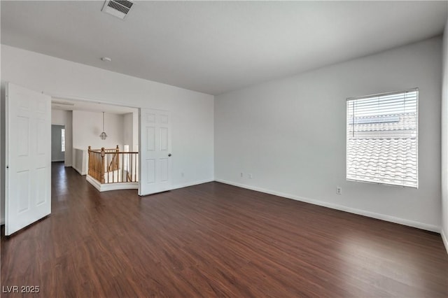 7977 Blue Brook Dr, Las Vegas, NV 89147 - spare room with dark wood-type flooring and baseboards