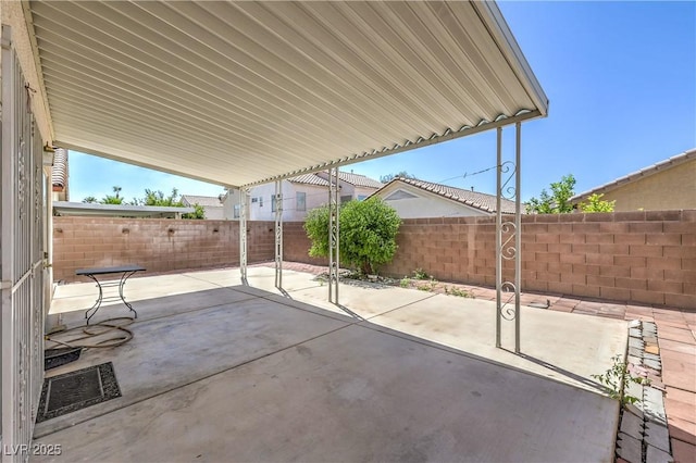 7977 Blue Brook Dr, Las Vegas, NV 89147 - fenced backyard featuring a patio