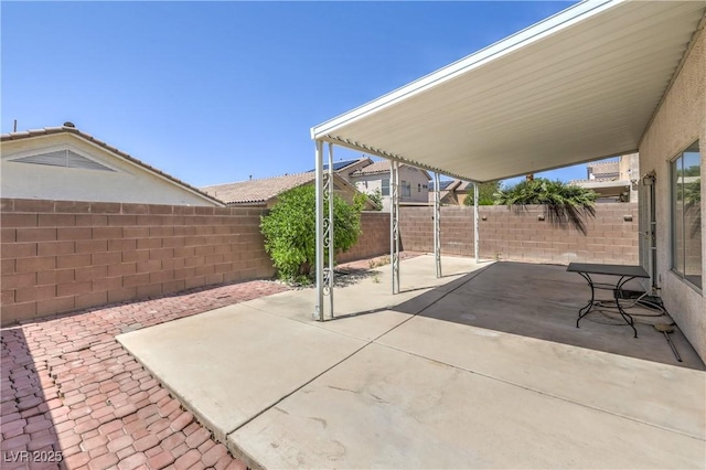 7977 Blue Brook Dr, Las Vegas, NV 89147 - fenced backyard featuring a patio