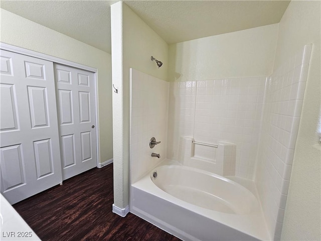 6824 Briarwood Bend Ave, Las Vegas, NV 89130 - bathroom with wood finished floors, tub / shower combination, and a textured ceiling