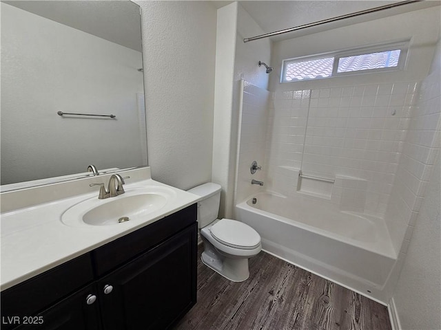 6824 Briarwood Bend Ave, Las Vegas, NV 89130 - bathroom with tub / shower combination, vanity, wood finished floors, and a textured wall