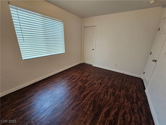 6824 Briarwood Bend Ave, Las Vegas, NV 89130 - unfurnished bedroom featuring wood finished floors and baseboards