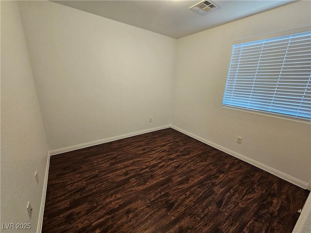6824 Briarwood Bend Ave, Las Vegas, NV 89130 - empty room with dark wood-style floors and baseboards