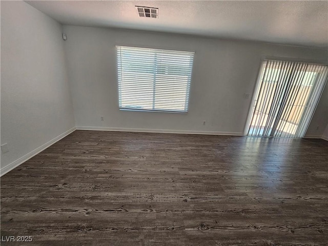 6824 Briarwood Bend Ave, Las Vegas, NV 89130 - spare room featuring dark wood finished floors and a textured ceiling