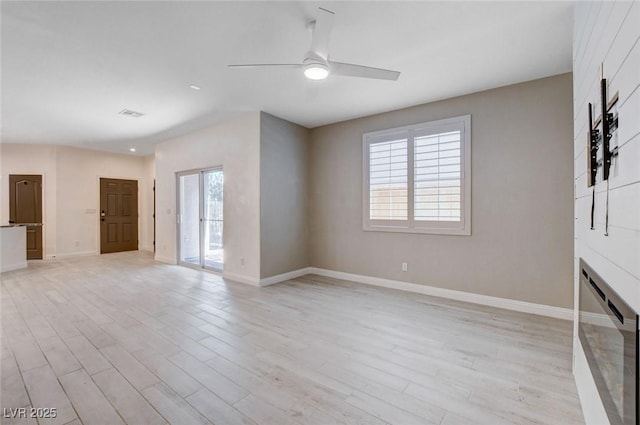 10556 Sariah Skye Ave, Las Vegas, NV 89166 - unfurnished living room with ceiling fan and light wood-style floors