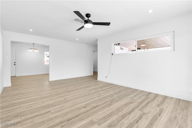 2105 Berkley Ave, Las Vegas, NV 89101 - unfurnished room featuring a chandelier, light wood-type flooring, a ceiling fan, and recessed lighting