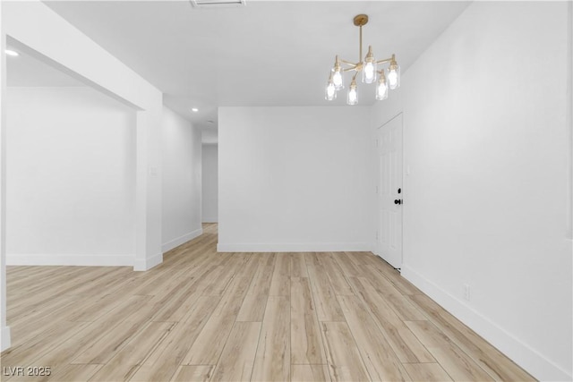 2105 Berkley Ave, Las Vegas, NV 89101 - empty room with light wood finished floors, a chandelier, and recessed lighting