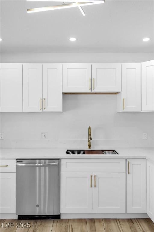 2105 Berkley Ave, Las Vegas, NV 89101 - kitchen with dishwasher, white cabinetry, light countertops, light wood finished floors, and recessed lighting