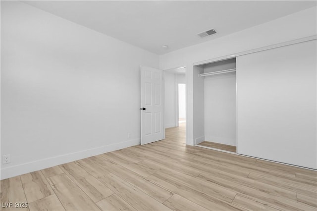 2105 Berkley Ave, Las Vegas, NV 89101 - unfurnished bedroom featuring light wood-type flooring and a closet