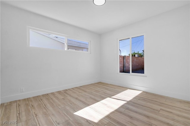 2105 Berkley Ave, Las Vegas, NV 89101 - spare room featuring wood finished floors and baseboards