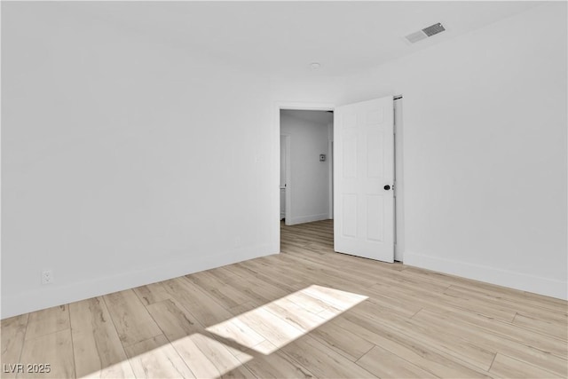 2105 Berkley Ave, Las Vegas, NV 89101 - unfurnished room featuring wood finished floors and baseboards