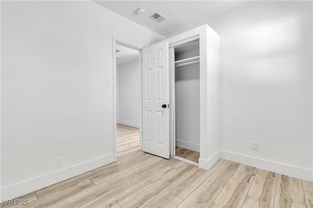 2105 Berkley Ave, Las Vegas, NV 89101 - unfurnished bedroom with light wood-type flooring and a closet