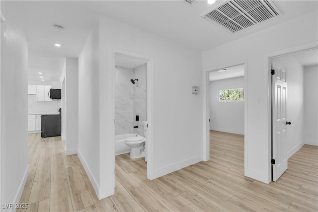2105 Berkley Ave, Las Vegas, NV 89101 - corridor with light wood-style floors and recessed lighting