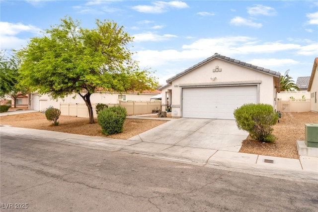 5733 Dazzling Sparks St, North Las Vegas, NV 89031 - view of front of house featuring concrete driveway, stucco siding, and a garage