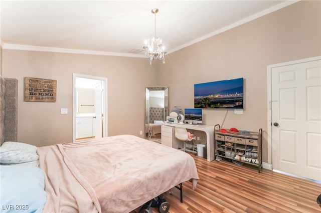 5733 Dazzling Sparks St, North Las Vegas, NV 89031 - bedroom with crown molding, wood finished floors, a chandelier, ensuite bathroom, and a desk