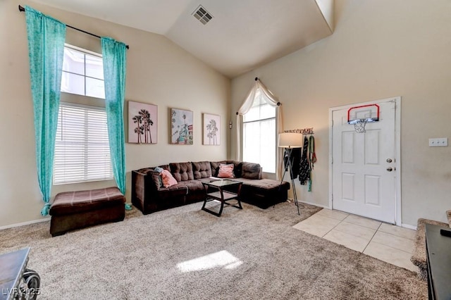 7137 Eyebright St, Las Vegas, NV 89131 - living room featuring carpet, vaulted ceiling, plenty of natural light, and tile patterned flooring