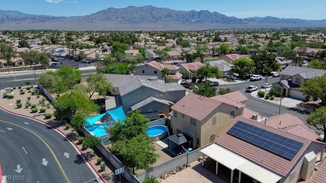 7137 Eyebright St, Las Vegas, NV 89131 - aerial perspective of suburban area featuring a pool and mountains