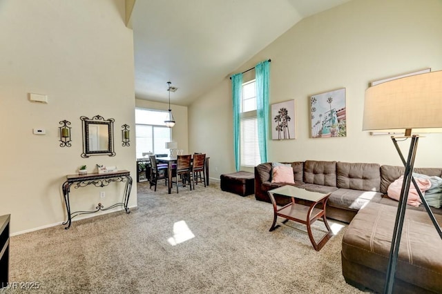 7137 Eyebright St, Las Vegas, NV 89131 - living room with vaulted ceiling, healthy amount of natural light, and carpet flooring