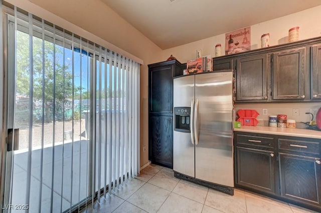 7137 Eyebright St, Las Vegas, NV 89131 - kitchen with stainless steel fridge with ice dispenser, light tile patterned floors, and light countertops