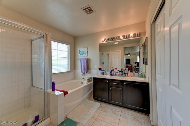 7137 Eyebright St, Las Vegas, NV 89131 - full bath featuring tile patterned flooring, a bath, a stall shower, and double vanity