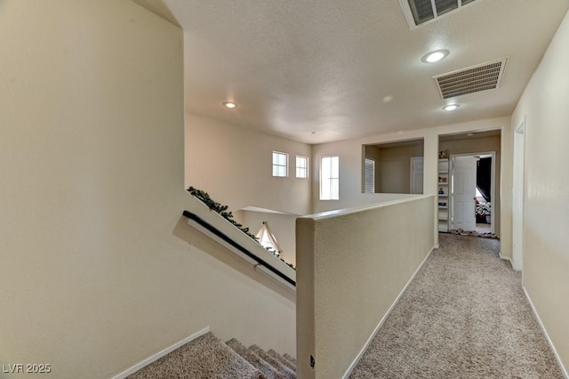7137 Eyebright St, Las Vegas, NV 89131 - corridor with carpet floors, an upstairs landing, recessed lighting, and a textured ceiling