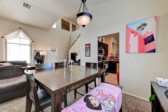 7137 Eyebright St, Las Vegas, NV 89131 - dining area featuring vaulted ceiling and light colored carpet