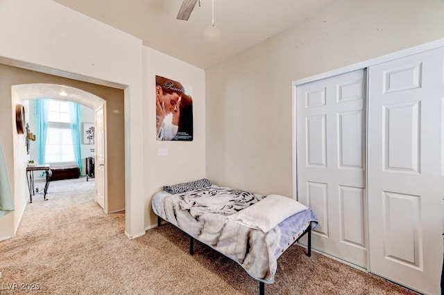 7137 Eyebright St, Las Vegas, NV 89131 - bedroom featuring light colored carpet, a ceiling fan, and arched walkways