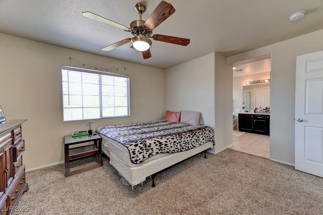 7137 Eyebright St, Las Vegas, NV 89131 - bedroom with light carpet, ensuite bathroom, and a ceiling fan