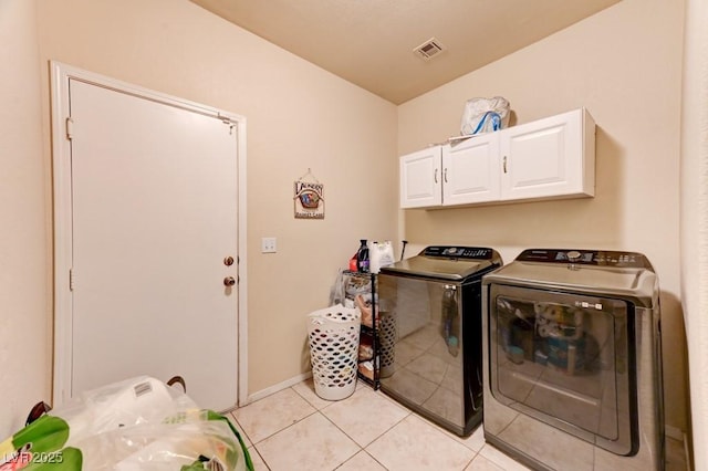 7137 Eyebright St, Las Vegas, NV 89131 - washroom with cabinet space, washer and dryer, and light tile patterned floors