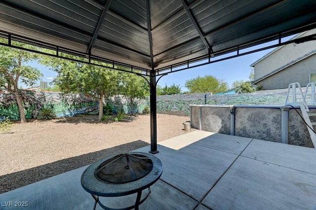 7137 Eyebright St, Las Vegas, NV 89131 - fenced backyard featuring a fire pit and a patio area
