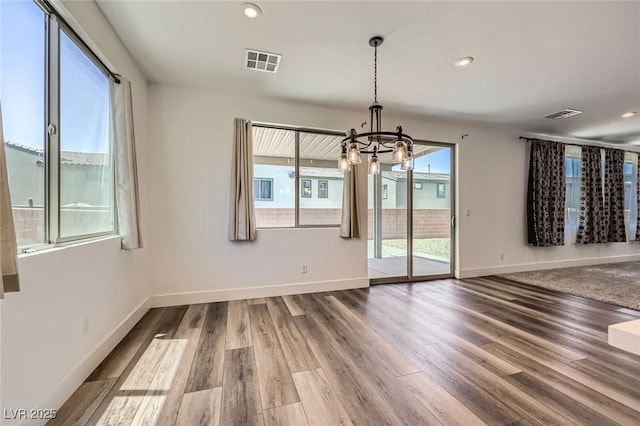1213 Granite Falls Pl, North Las Vegas, NV 89084 - unfurnished dining area featuring a chandelier, wood finished floors, and recessed lighting